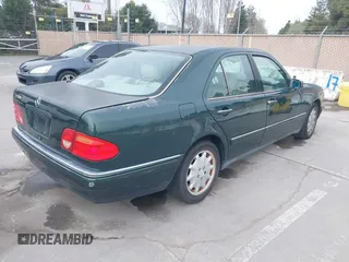 1997 Mercedes-Benz E-Class with VIN WDBJF55F3VJ034009, listed as a IAAI auction lot 41710225 with 239,673 mi miles. Bid and sale history available at carsss.com. Image 4.