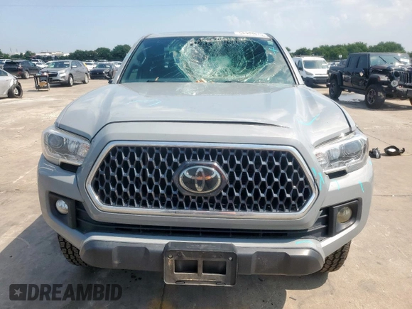 2019 Toyota Tacoma SR z VIN 5TFCZ5AN6KX211952, wystawiony jako Copart lot #58964815 z przebiegiem 97 774 mil mil oraz Szkoda całkowita • Salvage title. Historia ofert i sprzedaży dostępna na DreamBid. Obrazek 5.