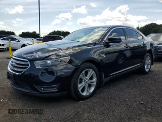 2015 Ford Taurus SEL with VIN 1FAHP2H80FG121265, listed as a Copart auction lot 65214055 with 128,145 mi miles and Salvage title. Bid and sale history available at DreamBid. Image 1.