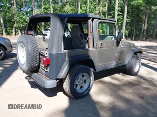 2003 Jeep Wrangler Sport z VIN 1J4FA49S13P313180, wystawiony jako IAAI lot #42349673 z przebiegiem 141 073 mil mil oraz . Historia ofert i sprzedaży dostępna na DreamBid. Obrazek 4.