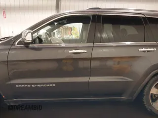 2015 Jeep Grand Cherokee Overland z VIN 1C4RJFCG1FC663469, wystawiony jako IAAI lot #41666113 z przebiegiem 140 159 mil mil oraz . Historia ofert i sprzedaży dostępna na DreamBid. Obrazek 14.