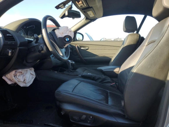 2012 BMW 1 Series 128i with VIN WBAUL7C58CVM82827, listed as a Copart auction lot 87487274 with 60,842 mi miles and Salvage Title. Bid and sale history available at carsss.com. Image 7.