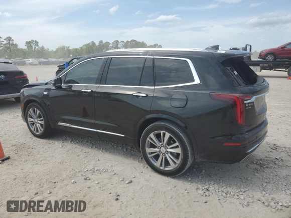 2023 Cadillac XT6 FWD Premium Luxury with VIN 1GYKPCRS6PZ127331, listed as a Copart auction lot 52951105 with 47,796 mi miles and Salvage Title. Bid and sale history available at carsss.com. Image 2.
