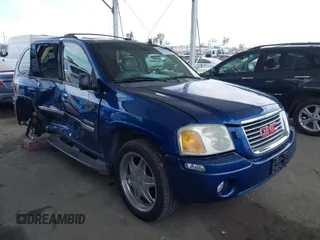 2006 GMC Envoy SLE with VIN 1GKDS13S562252049, listed as a IAAI auction lot 41940052 with 149,445 mi miles. Bid and sale history available at carsss.com. Image 1.
