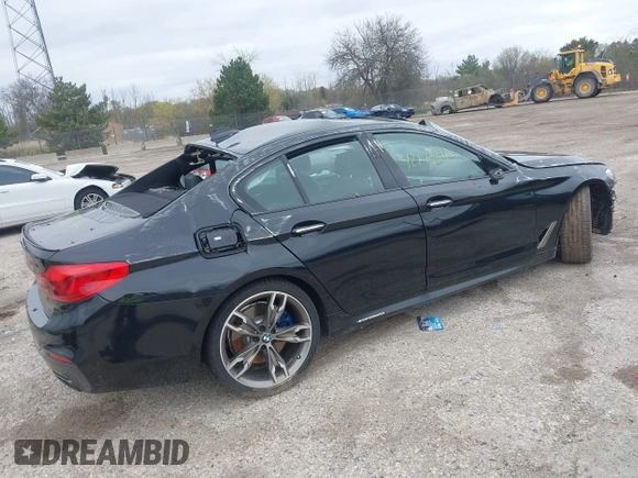 2018 BMW 5 Series M550i xDrive with VIN WBAJB9C56JB286742, listed as a IAAI auction lot 42176643 with 61,445 mi miles and . Bid and sale history available at DreamBid. Image 4.