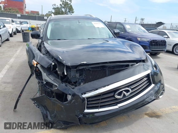 2014 Infiniti QX70 z VIN JN8CS1MW6EM410091, wystawiony jako IAAI lot #41896327 z przebiegiem 139 021 mil mil oraz . Historia ofert i sprzedaży dostępna na DreamBid. Obrazek 6.
