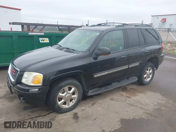 2002 GMC Envoy SLT with VIN 1GKDT13S222143135, listed as a IAAI auction lot 42136672 with 206,064 mi miles. Bid and sale history available at carsss.com. Image 2.
