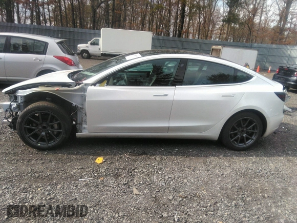 2020 Tesla Model 3 Standard Range Plus with VIN 5YJ3E1EA4LF792830, listed as a IAAI auction lot 41852919 with 76,461 mi miles. Bid and sale history available at carsss.com. Image 14.