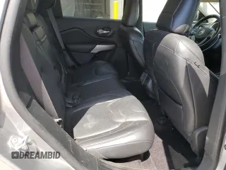 2016 Jeep Cherokee Overland z VIN 1C4PJMJSXGW300719, wystawiony jako Copart lot #58216665 z przebiegiem 128 016 mil mil oraz Szkoda całkowita • Salvage title. Historia ofert i sprzedaży dostępna na DreamBid. Obrazek 11.