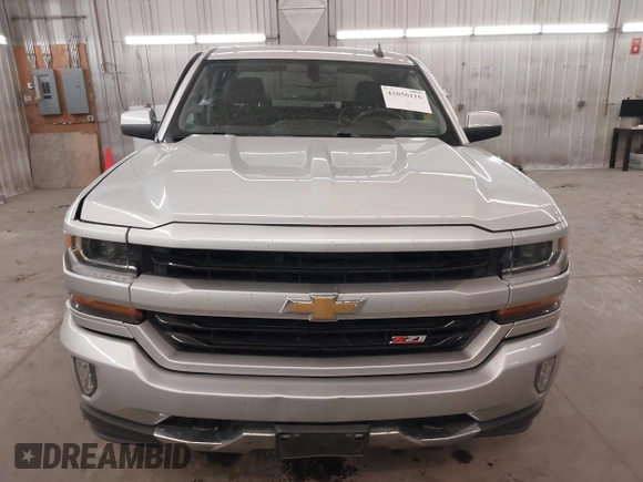 2017 Chevrolet Silverado 1500 LT with VIN 3GCUKREC5HG318772, listed as a IAAI auction lot 42056116 with 82,987 mi miles and . Bid and sale history available at DreamBid. Image 13.