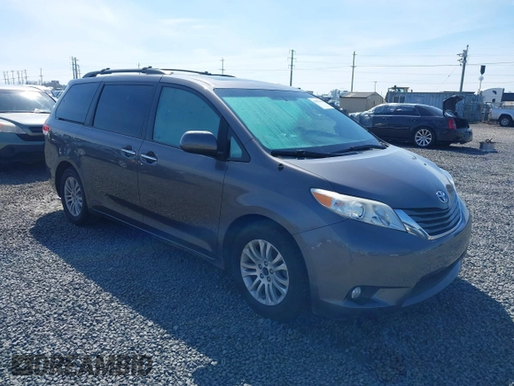2014 Toyota Sienna XLE with VIN 5TDYK3DC5ES451965, listed as a IAAI auction lot 41879334 with 145,114 mi miles and . Bid and sale history available at DreamBid. Image 1.