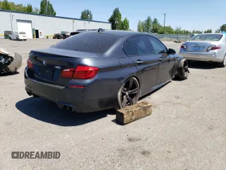 2013 BMW M5 z VIN WBSFV9C50DC774172, wystawiony jako Copart lot #61990854 z przebiegiem Nie podano mil oraz Szkoda całkowita • Salvage title. Historia ofert i sprzedaży dostępna na DreamBid. Obrazek 3.
