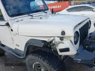 2001 Jeep Wrangler Sport with VIN 1J4FA49S41P308407, listed as a IAAI auction lot 41772240 with 139,461 mi miles. Bid and sale history available at carsss.com. Image 6.