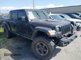2021 Jeep Gladiator Rubicon z VIN 1C6JJTBG8ML516101, wystawiony jako IAAI lot #41614523 z przebiegiem 80 266 mil mil oraz . Historia ofert i sprzedaży dostępna na DreamBid. Obrazek 1.