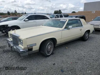 1984 Cadillac Eldorado z VIN 1G6AL5784EE619136, wystawiony jako Copart lot #51120795 z przebiegiem 97 429 mil mil oraz Czysty tytuł • Clean title. Historia ofert i sprzedaży dostępna na DreamBid. Obrazek 1.