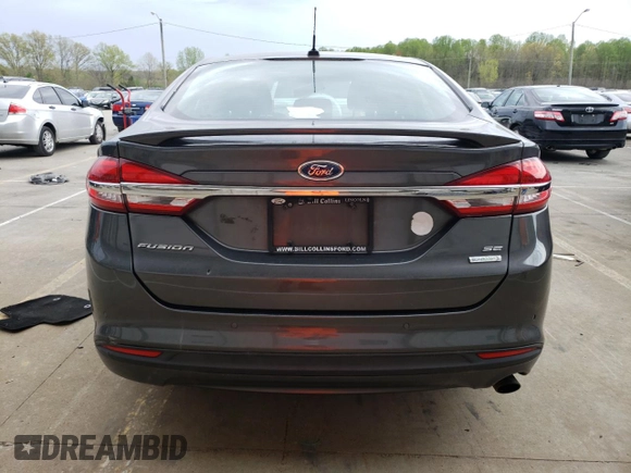 2018 Ford Fusion SE z VIN 3FA6P0HD8JR245391, wystawiony jako Copart lot #53571445 z przebiegiem 158 138 mil mil oraz Czysty tytuł • Clean title. Historia ofert i sprzedaży dostępna na DreamBid. Obrazek 6.