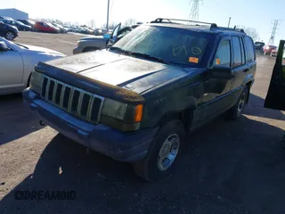 1997 Jeep Grand Cherokee Laredo with VIN 1J4GZ58S2VC605385, listed as a IAAI auction lot 41797715 with 169,996 mi miles and . Bid and sale history available at DreamBid. Image 2.