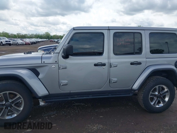 2019 Jeep Wrangler Unlimited Sahara with VIN 1C4HJXEN5KW542403, listed as a IAAI auction lot 42159197 with 60,378 mi miles and . Bid and sale history available at DreamBid. Image 14.