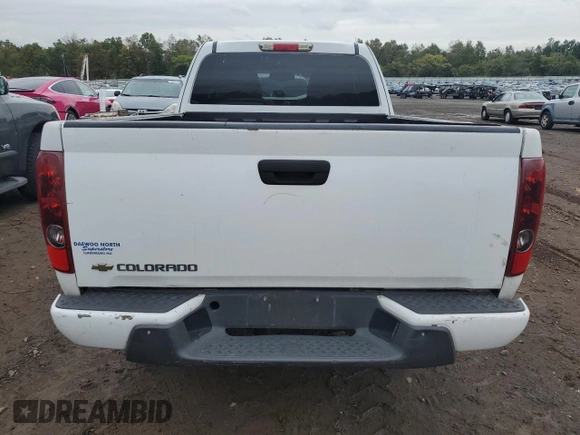2012 Chevrolet Colorado z VIN 1GCJTBF9XC8107897, wystawiony jako Copart lot #73186684 z przebiegiem 144 655 mil mil oraz Czysty tytuł • Clean title. Historia ofert i sprzedaży dostępna na DreamBid. Obrazek 6.