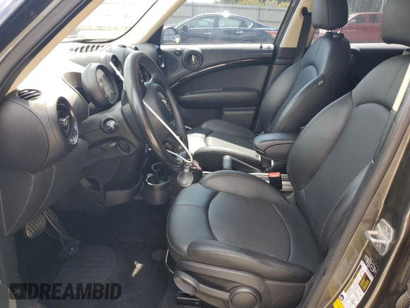 2014 MINI Countryman S with VIN WMWZC3C57EWP25099, listed as a Copart auction lot 62646555 with 153,059 mi miles and Salvage title. Bid and sale history available at DreamBid. Image 7.