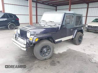 1999 Jeep Wrangler Sport with VIN 1J4FY19S1XP402974, listed as a IAAI auction lot 41659511 with 152,024 mi miles. Bid and sale history available at carsss.com. Image 2.