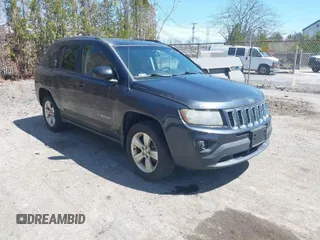 2014 Jeep Compass Sport with VIN 1C4NJDBB4ED689503, listed as a IAAI auction lot 42079098 with 104,433 mi miles. Bid and sale history available at carsss.com. Image 1.
