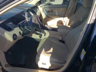 2015 Ford Taurus SEL with VIN 1FAHP2E90FG148821, listed as a Copart auction lot 77557384 with 141,514 mi miles and Salvage Title. Bid and sale history available at DreamBid. Image 7.