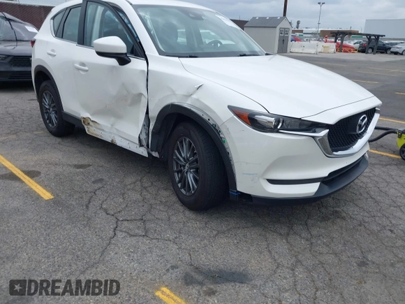 2019 Mazda CX-5 Sport with VIN JM3KFABM4K1565787, listed as a IAAI auction lot 42054585 with 80,580 mi miles and . Bid and sale history available at DreamBid. Image 1.