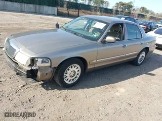 2003 Mercury Grand Marquis GS Convenience with VIN 2MEFM74W43X681774, listed as a IAAI auction lot 42057422 with 218,422 mi miles. Bid and sale history available at carsss.com. Image 2.