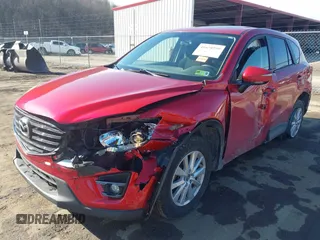 2016 Mazda CX-5 Touring with VIN JM3KE4CY4G0860035, listed as a IAAI auction lot 41678299 with 72,101 mi miles. Bid and sale history available at carsss.com. Image 17.