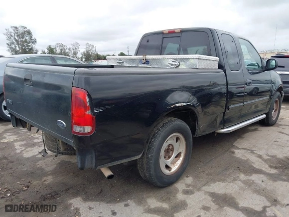 1999 Ford F-150 Work Series with VIN 1FTZX1720XKA54784, listed as a IAAI auction lot 41572757 with NaN miles. Bid and sale history available at carsss.com. Image 4.