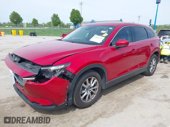 2016 Mazda CX-9 Touring with VIN JM3TCACY4G0112961, listed as a IAAI auction lot 42094718 with 114,679 mi miles and . Bid and sale history available at DreamBid. Image 2.