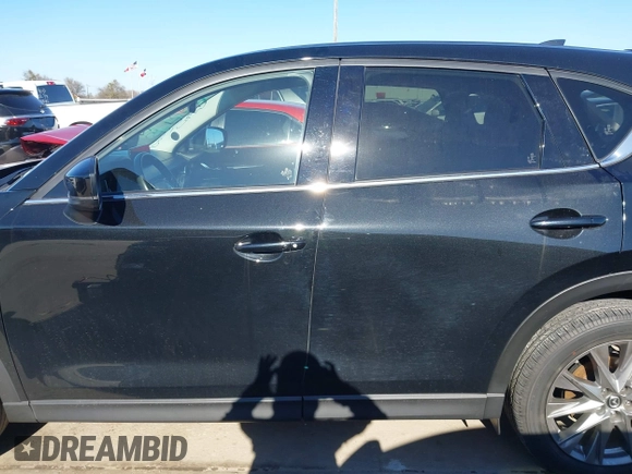 2021 Mazda CX-5 Grand Touring with VIN JM3KFADM1M0406098, listed as a IAAI auction lot 41654735 with 33,050 mi miles. Bid and sale history available at carsss.com. Image 14.