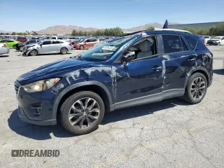 2016 Mazda CX-5 Grand Touring z VIN JM3KE2DY3G0739080, wystawiony jako Copart lot #58254235 z przebiegiem 93 133 mil mil oraz Szkoda całkowita • Salvage title. Historia ofert i sprzedaży dostępna na DreamBid. Obrazek 1.