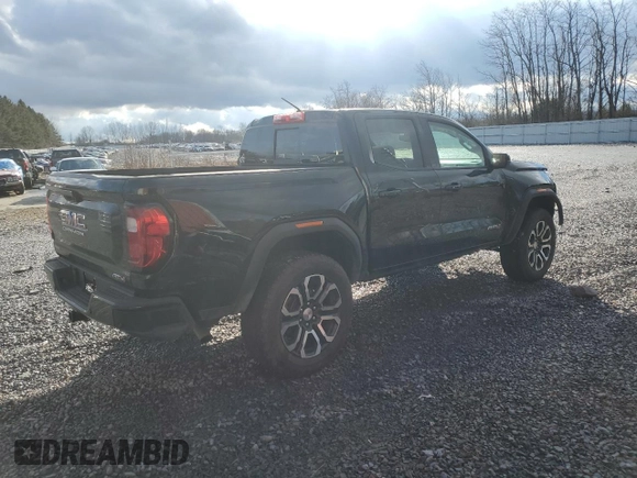 2024 GMC Canyon 4WD AT4 with VIN 1GTP6DEK2R1180037, listed as a Copart auction lot 85656994 with 7,565 mi miles and Salvage Title. Bid and sale history available at carsss.com. Image 3.