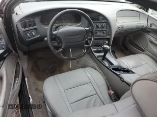 1997 Ford Thunderbird LX with VIN 1FALP62W2VH154138, listed as a Copart auction lot 46281235 with 145,738 mi miles and Clean Title. Bid and sale history available at DreamBid. Image 8.
