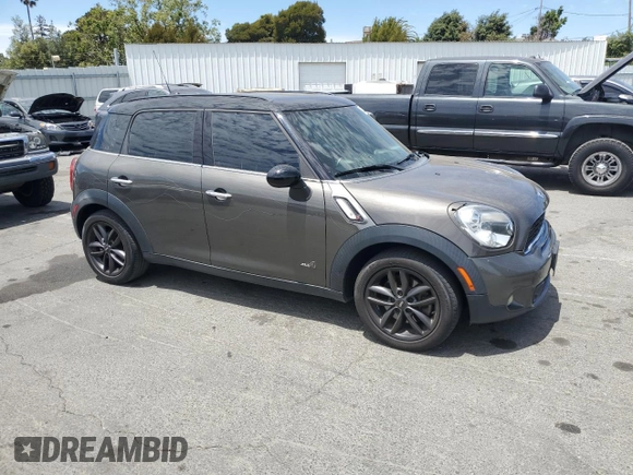 2011 MINI Countryman S with VIN WMWZC5C5XBWL55516, listed as a Copart auction lot 63239235 with 137,545 mi miles and Salvage title. Bid and sale history available at DreamBid. Image 4.