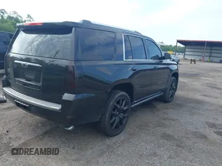 2015 Chevrolet Tahoe LTZ with VIN 1GNSCCKC5FR103676, listed as a IAAI auction lot 42456913 with 214,009 mi miles and . Bid and sale history available at DreamBid. Image 4.