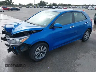 2023 Kia Rio S with VIN 3KPA25AD4PE558982, listed as a IAAI auction lot 41338270 with 40,965 mi miles and . Bid and sale history available at DreamBid. Image 2.