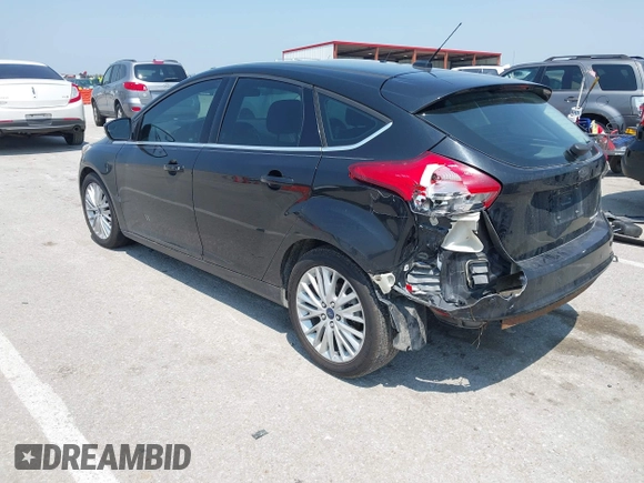 2015 Ford Focus Titanium z VIN 1FADP3N27FL219978, wystawiony jako IAAI lot #42433005 z przebiegiem 175 459 mil mil oraz . Historia ofert i sprzedaży dostępna na DreamBid. Obrazek 3.