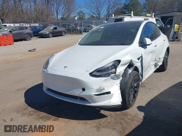 2021 Tesla Model Y Long Range with VIN 5YJYGDEE8MF125104, listed as a IAAI auction lot 41698065 with 25,177 mi miles and . Bid and sale history available at DreamBid. Image 2.