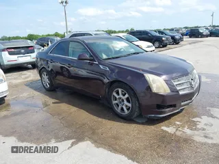 2008 Cadillac CTS RWD w/1SA with VIN 1G6DF577880140148, listed as a IAAI auction lot 42011365 with 156,136 mi miles. Bid and sale history available at carsss.com. Image 1.