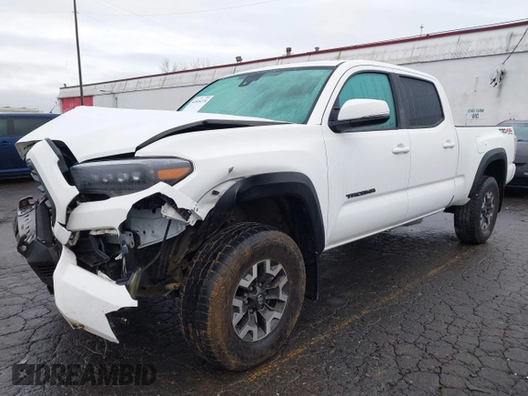 2021 Toyota Tacoma SR5 with VIN 3TMDZ5BN1MM100575, listed as a IAAI auction lot 41516274 with 61,974 mi miles and . Bid and sale history available at DreamBid. Image 2.