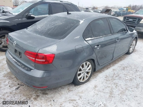 2015 Volkswagen Jetta Sedan 1.8T Sport with VIN 3VWD17AJ6FM319596, listed as a IAAI auction lot 41370591 with 92,818 mi miles. Bid and sale history available at carsss.com. Image 4.