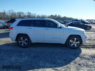 2014 Jeep Grand Cherokee Overland with VIN 1C4RJFCG9EC587322, listed as a IAAI auction lot 41632299 with 161,779 mi miles. Bid and sale history available at carsss.com. Image 13.