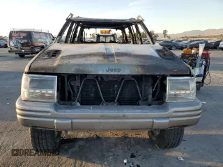 1998 Jeep Grand Cherokee Limited with VIN 1J4GZ88Z5WC119542, listed as a Copart auction lot 84562304 with 0 mi miles and Non Repairable. Bid and sale history available at carsss.com. Image 5.