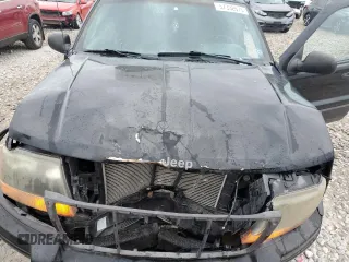 2000 Jeep Grand Cherokee Laredo z VIN 1J4GW48S1YC326453, wystawiony jako Copart lot #57332675 z przebiegiem 290 059 mil mil oraz Czysty tytuł • Clean title. Historia ofert i sprzedaży dostępna na DreamBid. Obrazek 12.