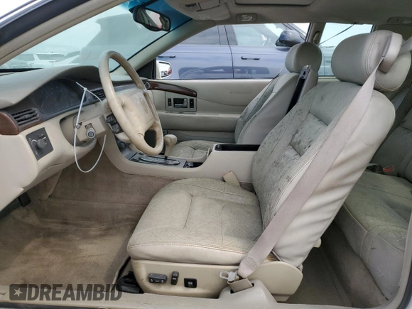 1999 Cadillac Eldorado z VIN 1G6EL12Y7XU615169, wystawiony jako Copart lot #76459744 z przebiegiem Nie podano mil oraz Szkoda całkowita • Salvage title. Historia ofert i sprzedaży dostępna na DreamBid. Obrazek 7.