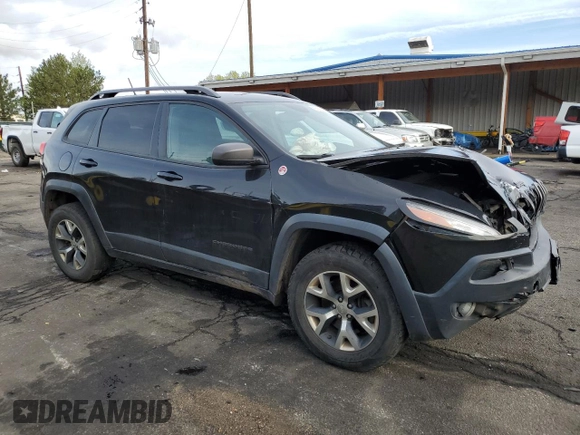 2015 Jeep Cherokee Trailhawk with VIN 1C4PJMBS9FW521872, listed as a Copart auction lot 55338955 with 146,602 mi miles and Salvage title. Bid and sale history available at DreamBid. Image 4.