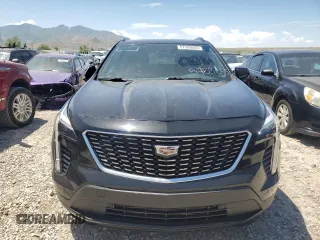 2019 Cadillac XT4 AWD Sport z VIN 1GYFZFR47KF152344, wystawiony jako Copart lot #57535655 z przebiegiem 70 107 mil mil oraz Szkody całkowita. Historia ofert i sprzedaży dostępna na DreamBid. Obrazek 5.